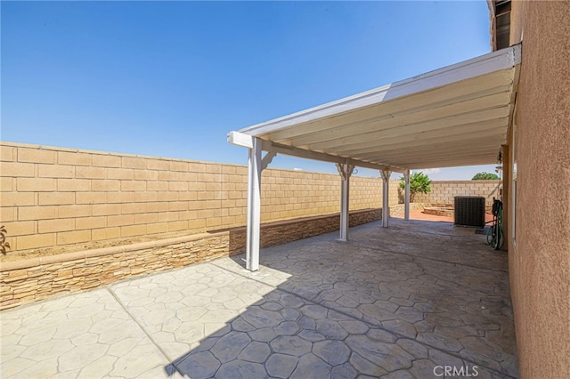 view of patio / terrace with a fenced backyard and central AC