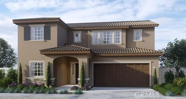 mediterranean / spanish home with a garage, driveway, and stucco siding