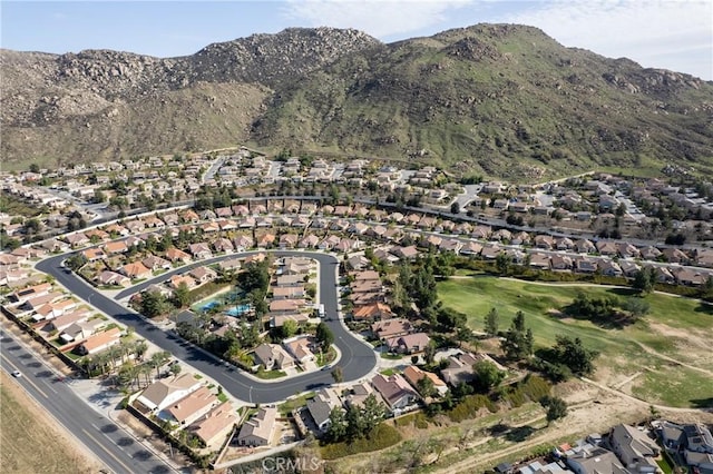 drone / aerial view featuring a residential view and a mountain view