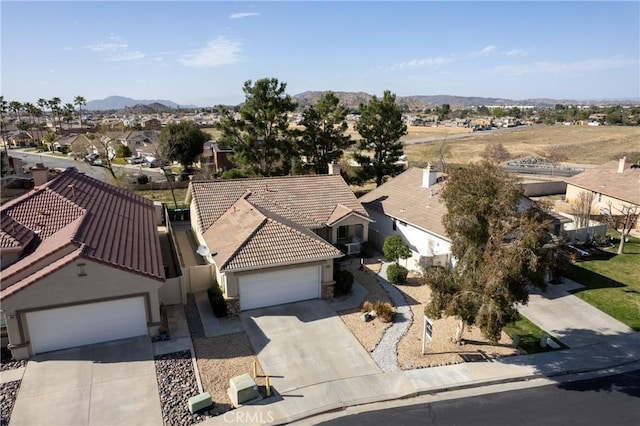 birds eye view of property featuring a residential view and a mountain view