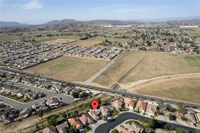 birds eye view of property featuring a residential view and a mountain view