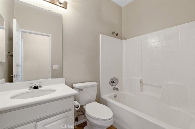 bathroom with  shower combination, vanity, and toilet