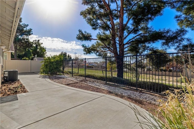 exterior space featuring central AC, a patio, and fence