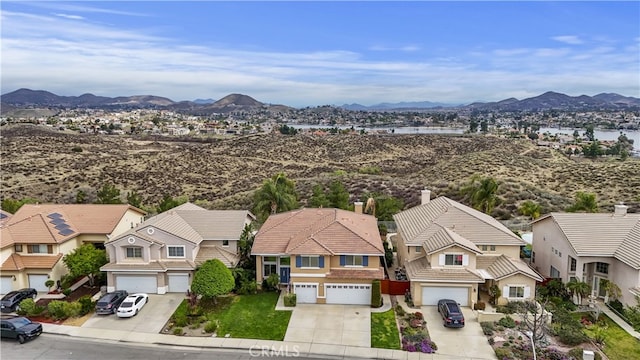 drone / aerial view featuring a residential view and a mountain view