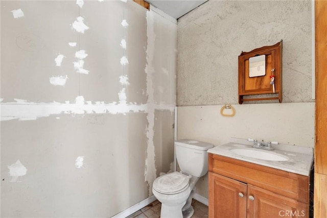 bathroom with toilet and vanity