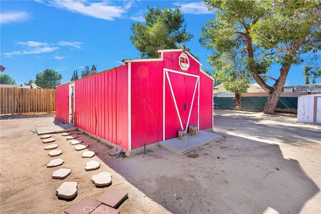 view of shed with a fenced backyard