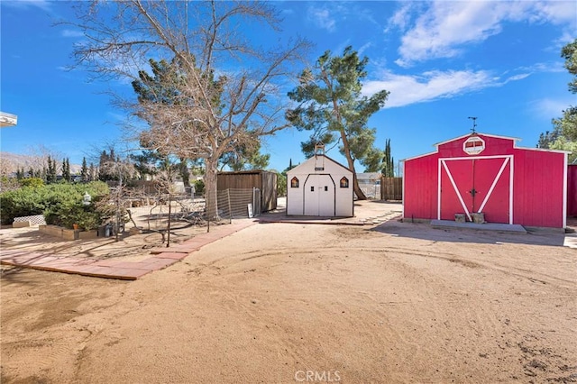 view of shed with fence