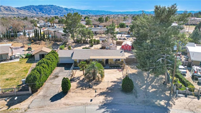 drone / aerial view featuring a residential view and a mountain view