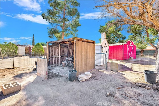 view of shed with fence