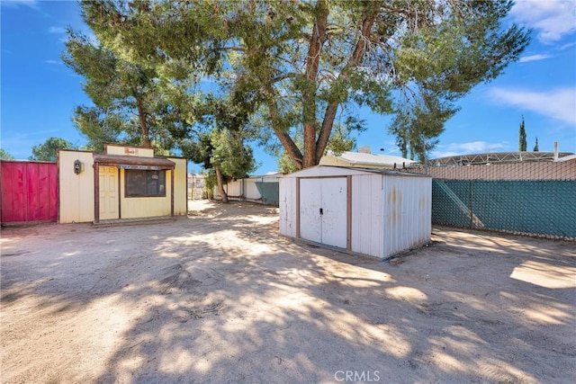 view of shed with a fenced backyard