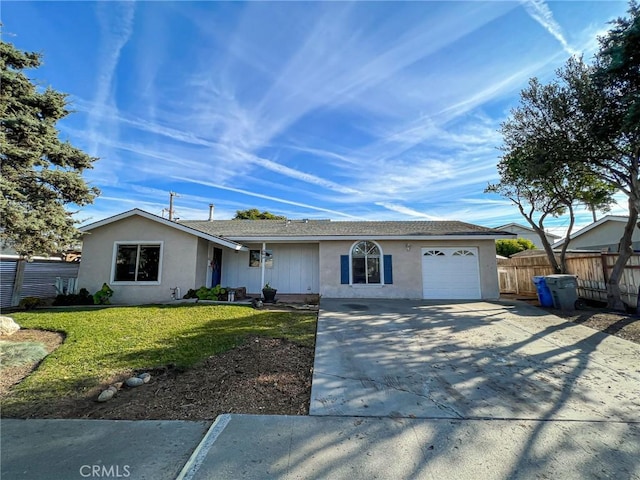 ranch-style house featuring a garage, fence, driveway, stucco siding, and a front yard