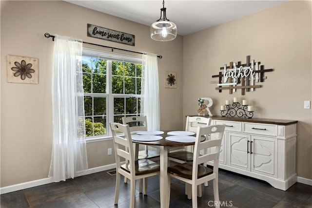 dining space with plenty of natural light, visible vents, and baseboards