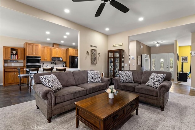 living room with ceiling fan and recessed lighting