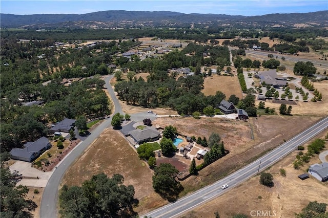 birds eye view of property with a mountain view