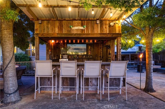 view of patio featuring outdoor dry bar and a gazebo