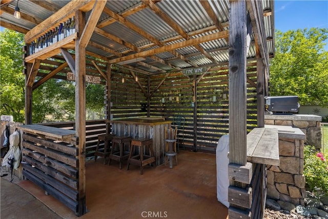 view of patio / terrace featuring an outdoor kitchen and outdoor dry bar