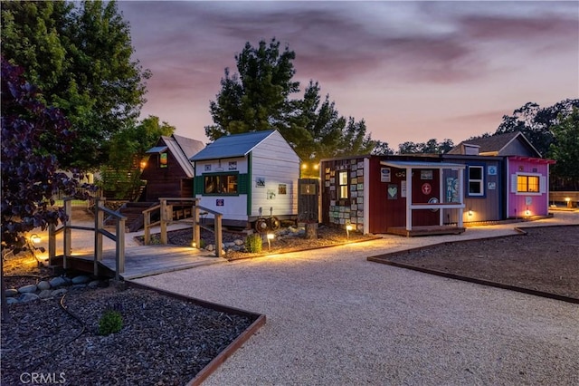 exterior space featuring an outbuilding and driveway