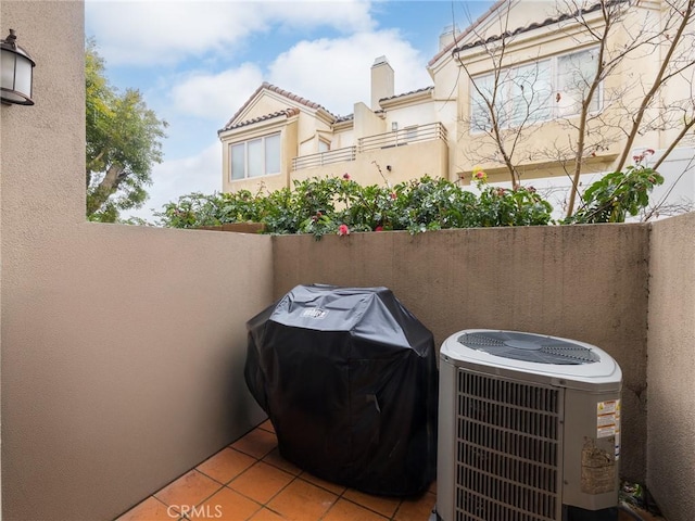 view of patio / terrace featuring fence, area for grilling, and central air condition unit