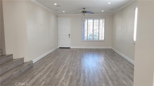 spare room with baseboards, recessed lighting, wood finished floors, and crown molding