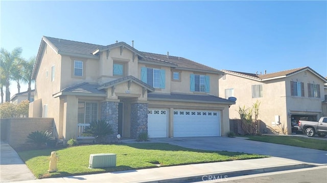 view of front of property featuring an attached garage, stone siding, concrete driveway, and stucco siding