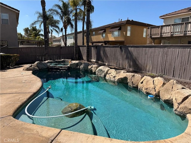 view of swimming pool featuring a fenced in pool and a fenced backyard