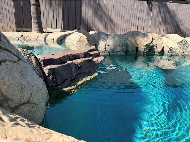 view of pool featuring fence and a fenced in pool