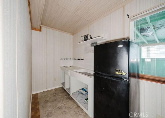2116 Rancho Rd, El Sobrante, CA 94803 - kitchen with freestanding refrigerator, wooden walls, white cabinets, and wood ceiling