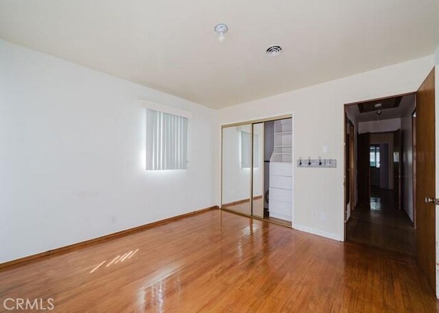 2116 Rancho Rd, El Sobrante, CA 94803 - unfurnished bedroom featuring wood finished floors and a closet
