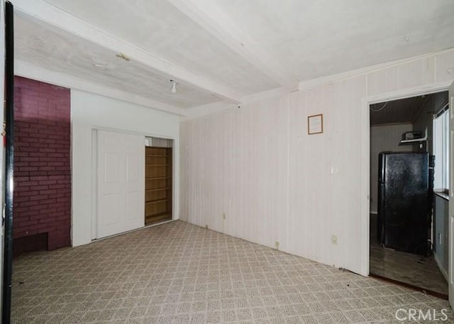 2116 Rancho Rd, El Sobrante, CA 94803 - empty room featuring beamed ceiling, carpet flooring, and wooden walls