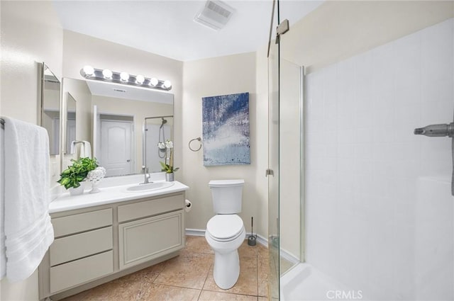 full bath with visible vents, toilet, a stall shower, vanity, and tile patterned flooring