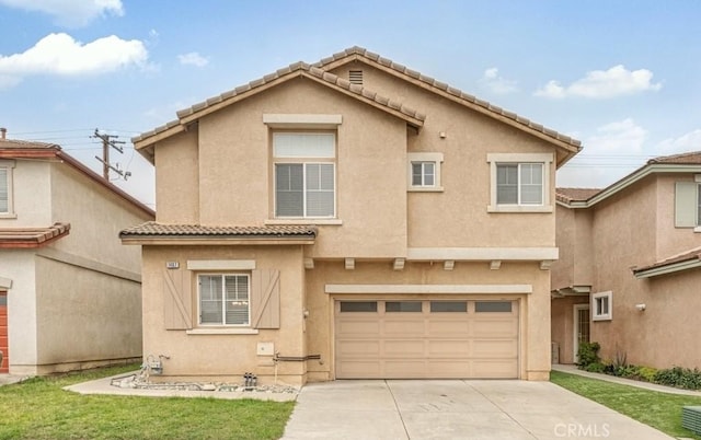 view of front of property with a garage, a tile roof, driveway, and stucco siding