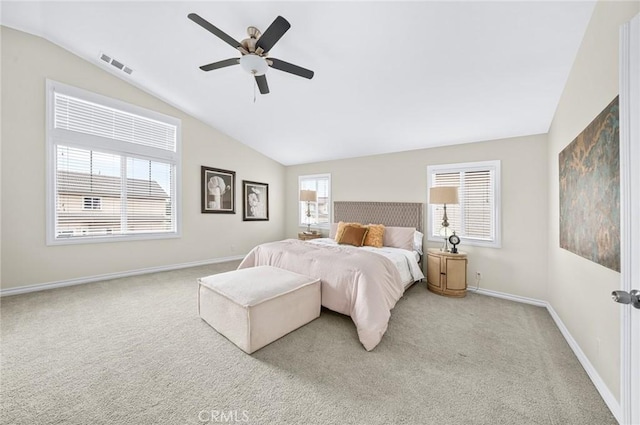 bedroom featuring carpet floors, baseboards, visible vents, and vaulted ceiling