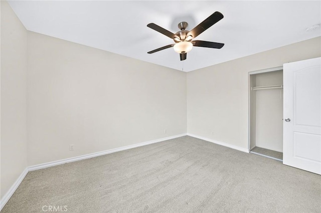 unfurnished bedroom featuring ceiling fan, carpet floors, a closet, and baseboards