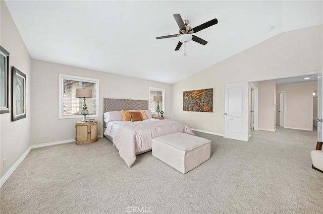 carpeted bedroom with a ceiling fan, vaulted ceiling, and baseboards