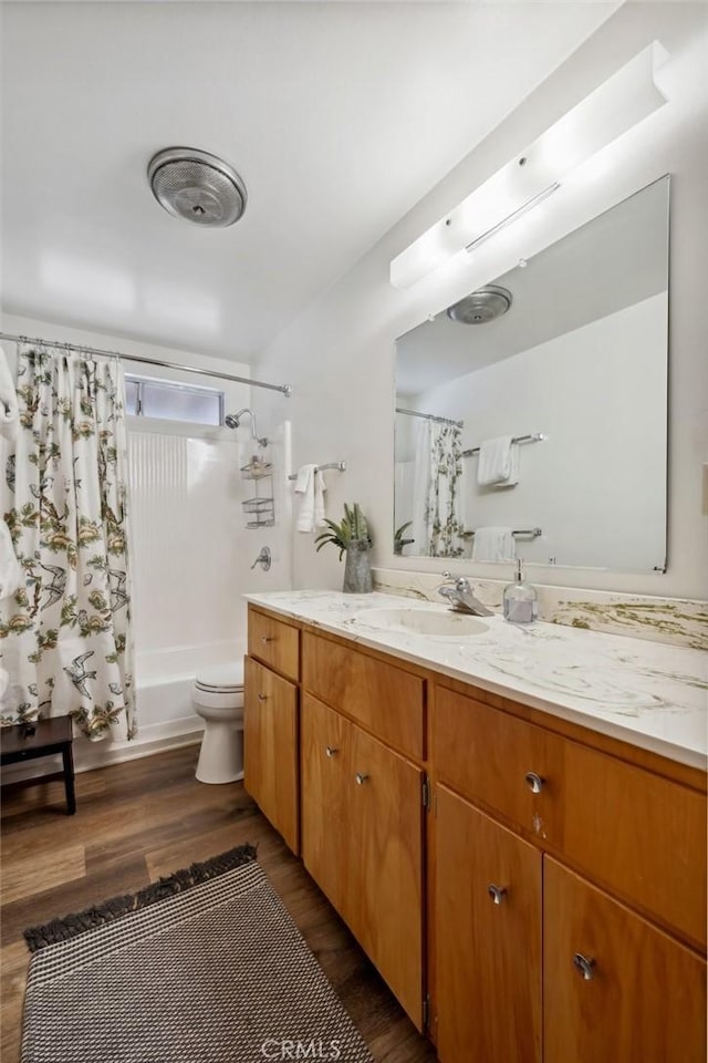 24950 Roble Dr, Idyllwild, CA 92549 - bathroom with toilet, shower / bathtub combination with curtain, wood finished floors, and vanity