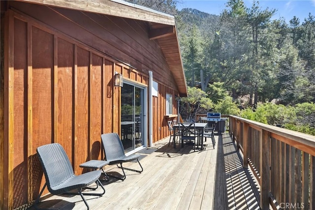 24950 Roble Dr, Idyllwild, CA 92549 - wooden deck with outdoor dining area and area for grilling