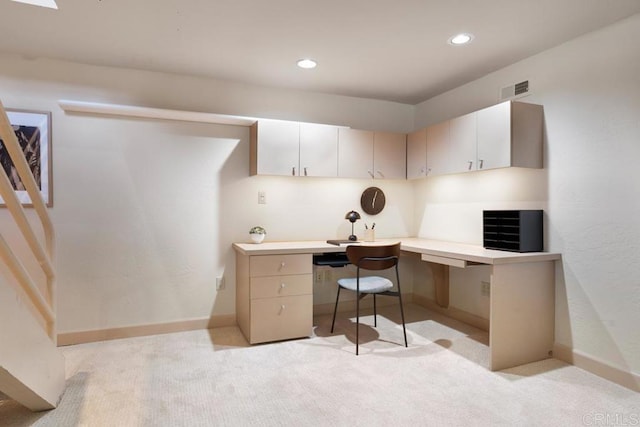 office space with light carpet, recessed lighting, visible vents, and built in study area