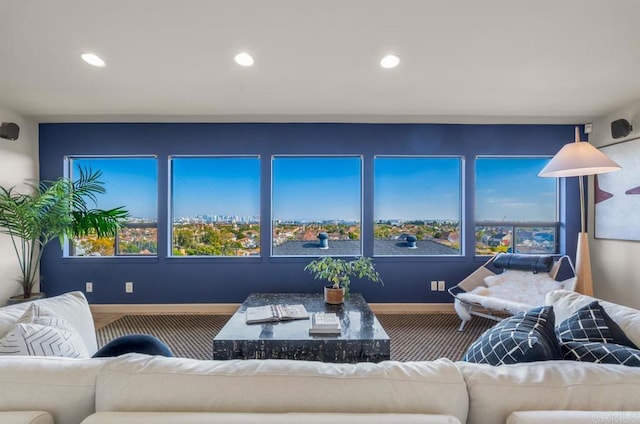 living room with baseboards, carpet floors, plenty of natural light, and recessed lighting