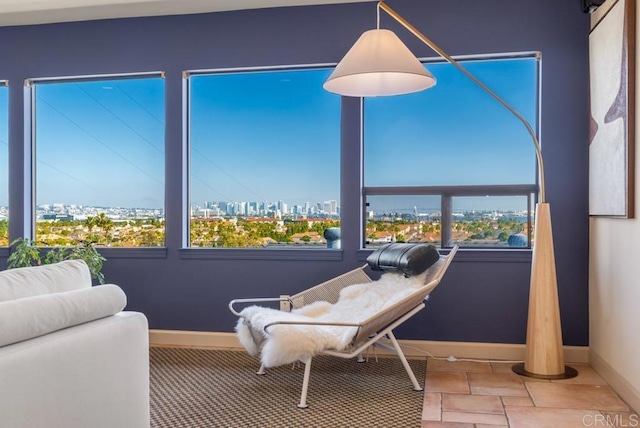 sunroom featuring a city view