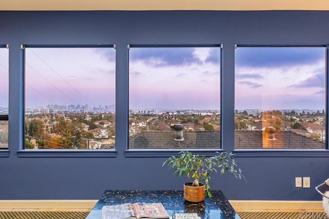 room details featuring a view of city and baseboards