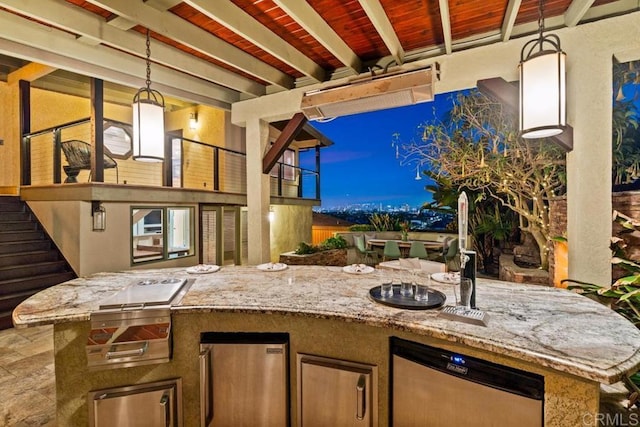 view of patio with stairway and an outdoor kitchen