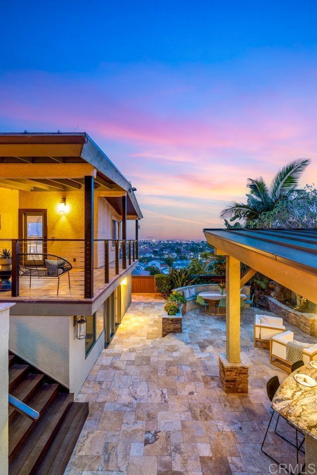 view of patio featuring a balcony