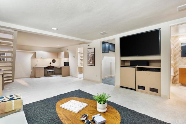 living room with light carpet, stairs, and recessed lighting