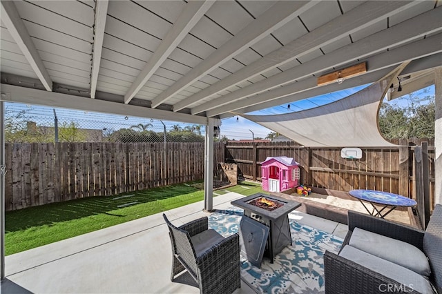 view of patio / terrace featuring a fire pit and a fenced backyard