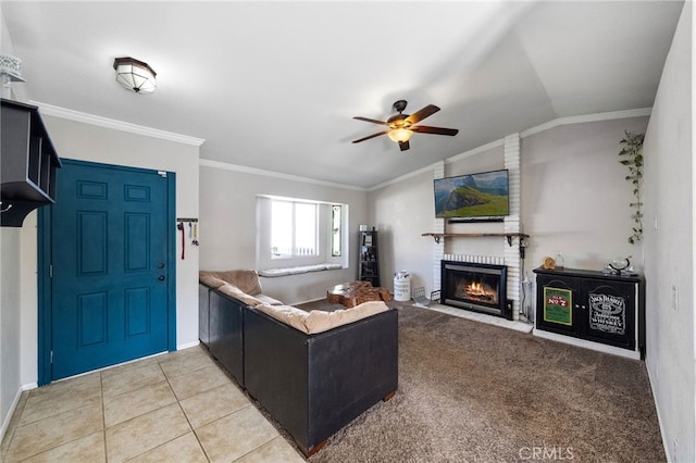 23883 Vista Way, Menifee, CA 92587 - living room with ornamental molding, ceiling fan, a fireplace, lofted ceiling, and light tile patterned floors