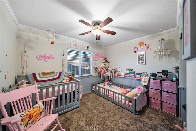 carpeted bedroom with a ceiling fan and crown molding