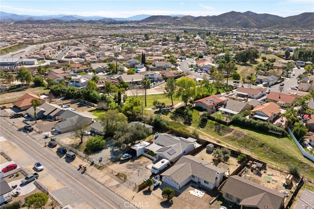 23883 Vista Way, Menifee, CA 92587 - aerial view of property and surrounding area with a mountain backdrop and nearby suburban area