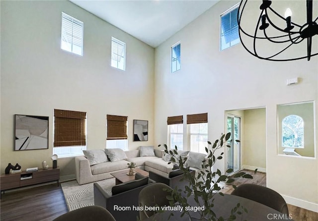 living room with baseboards and wood finished floors
