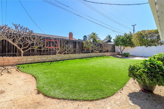 view of yard featuring a fenced backyard