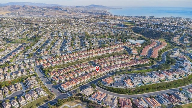 drone / aerial view with a residential view and a mountain view